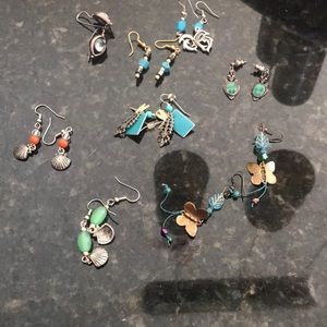 21 earrings and 3 broches